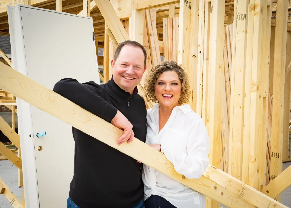 Charley and Alisa Wasson at a home under construction