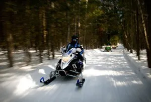 Riding snowmobiles at Lake Petenwell