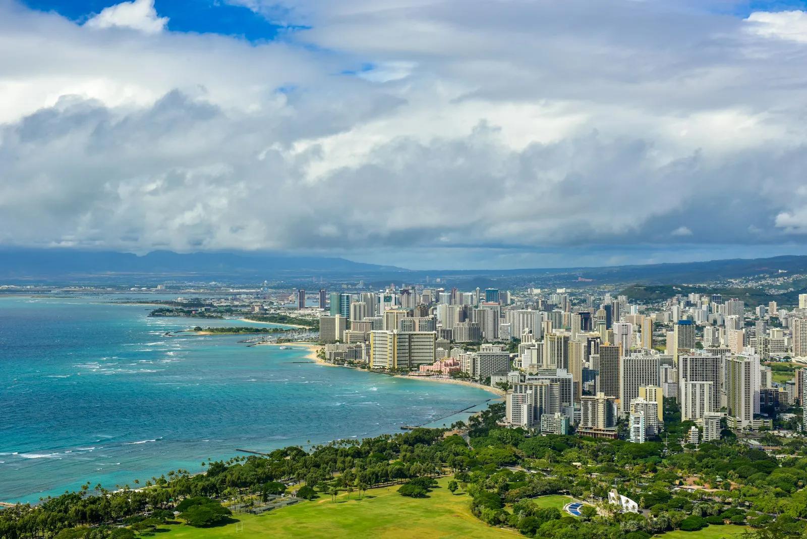 Waikiki and the Honolulu skyline seen from Diamond Head, with Kapiolani Park in the foreground