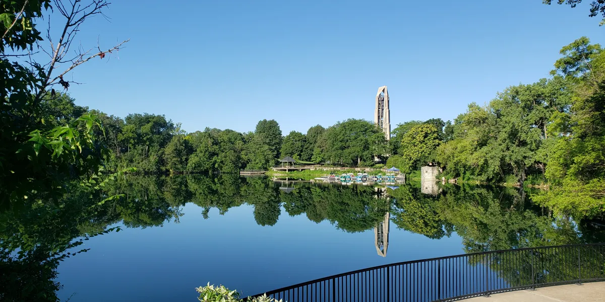 Millennium Carillon reflected in the Riverwalk Quarry in downtown Naperville