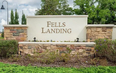 Entrance signage and landscaping at the Fell's Landing neighborhood in Orlando FL