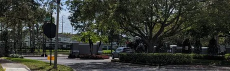 Landscaped gated entrance to the Savannah Pines condominium community off Moss Park Road in Lake Nona, Orlando FL