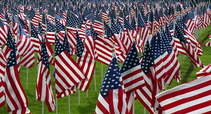 PEARL HARBOR, Hawaii (Dec. 8, 2007) More than 2,400 U.S. flags stand on Richardson field to remember the 66th anniversary of those killed in the attack on Pearl Harbor. U.S. Marine Corps photo by Cpl. Mark E Morrow Jr. [Public domain], via Wikimedia Commons"