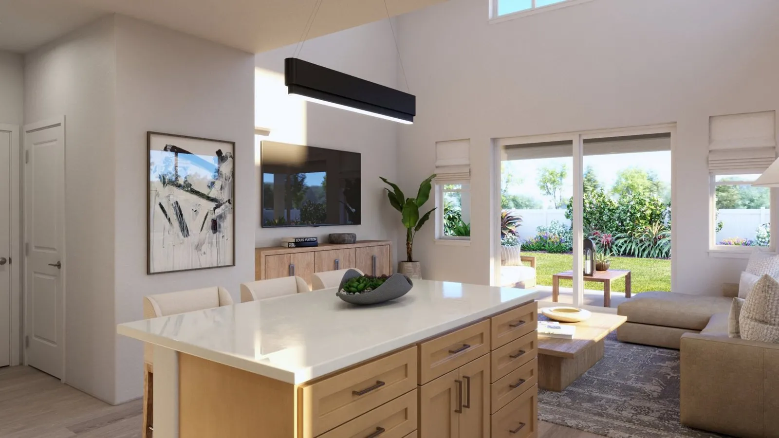 Plan 4 great room at Mau Loa at Koa Ridge viewed from the kitchen island, with high ceilings and sliding doors to the covered lanai and backyard