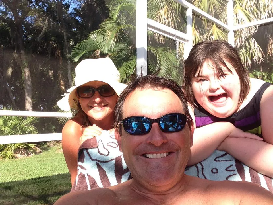 Scott and Jan enjoying a poolside family moment