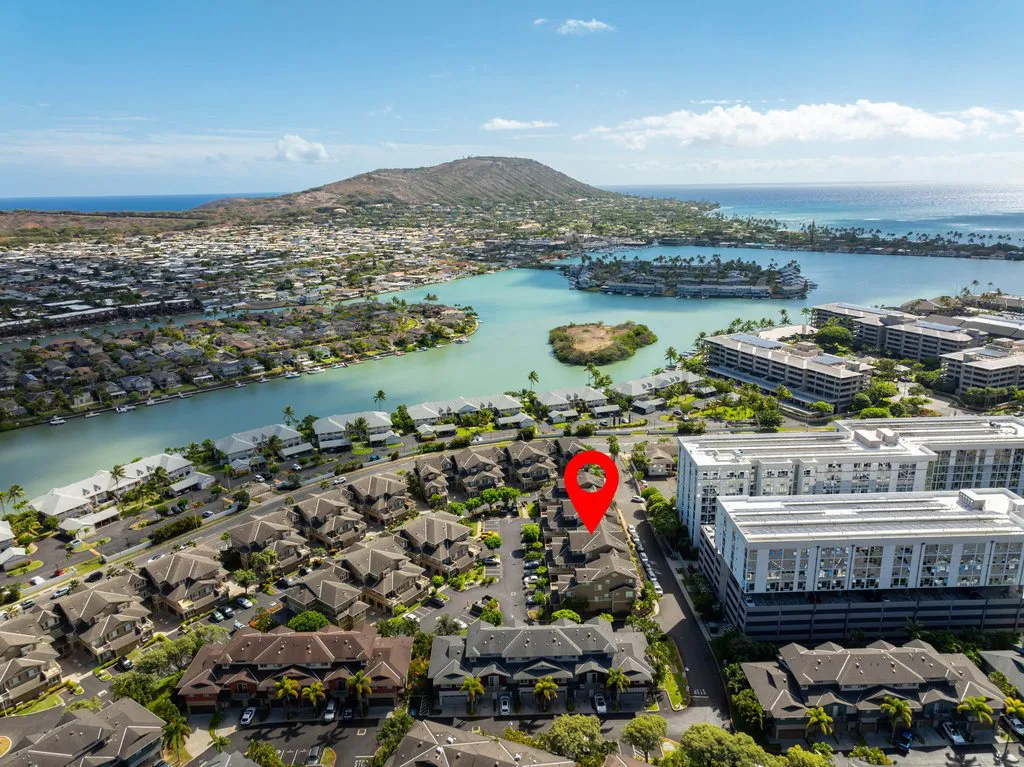 Drone photo of a Hawaiʻi Kai townhome community on the marina with Koko Head behind