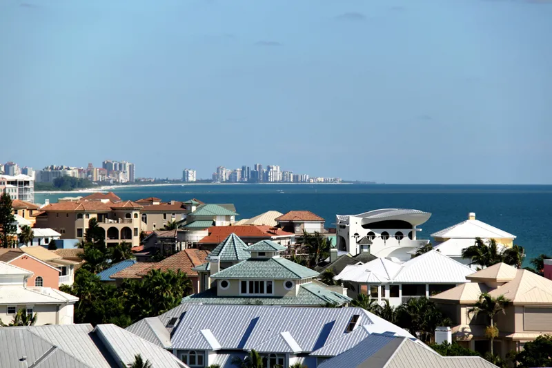 Aerial view of Barefoot Beach gated community and Gulf shoreline in Bonita Springs, Florida