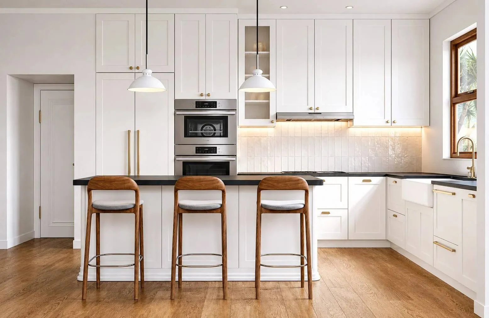 Rendering of an Aria Lane kitchen with white shaker cabinets, dark countertops, brass hardware, wall ovens and a three-seat island