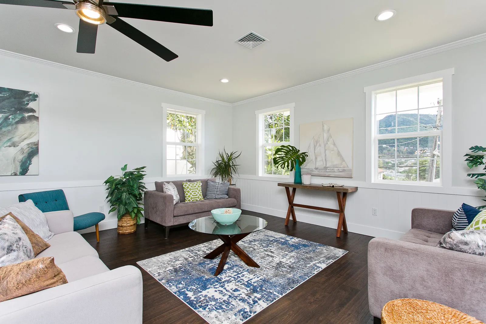 Bright living room in an Oahu home with open windows
