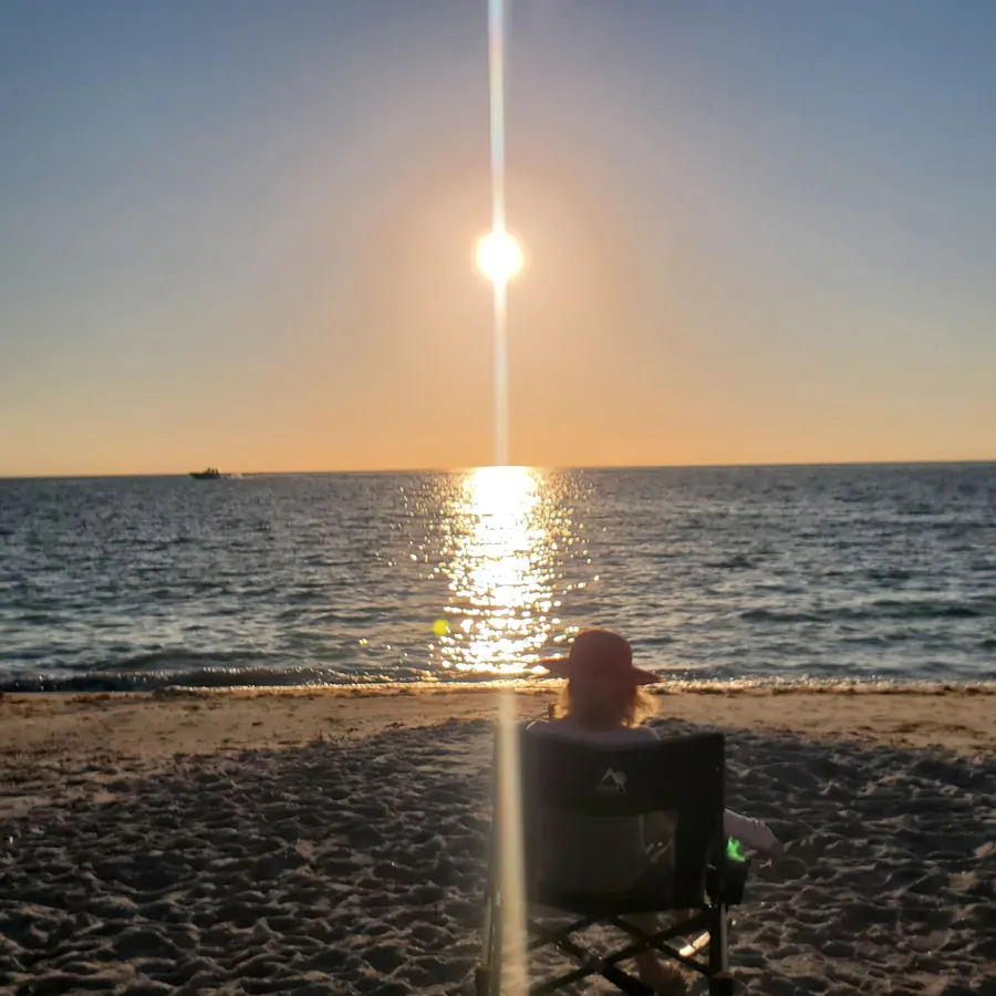 Sitting alone on the beach at sunset in Bonita Springs