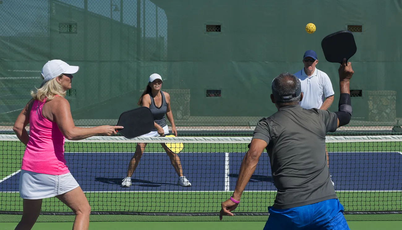 Pickleball players on a court in a Bonita Springs community