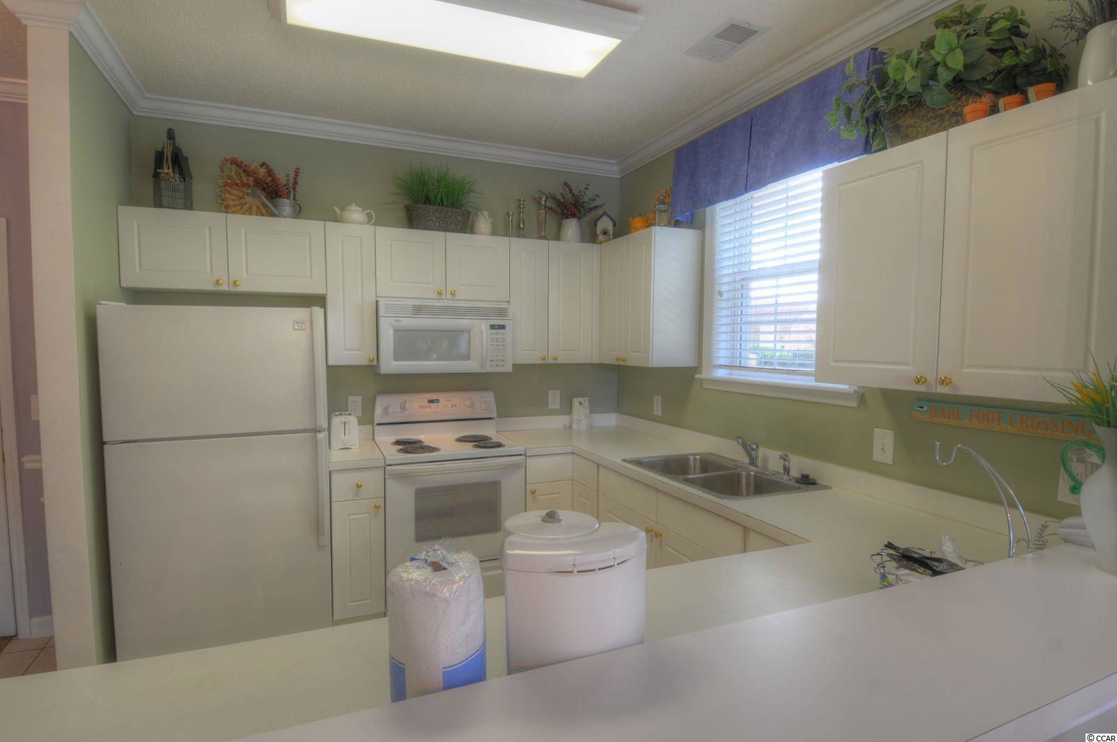 MLS 2203180 River Crossing Barefoot Resort 5825 Catalina Dr. Unit