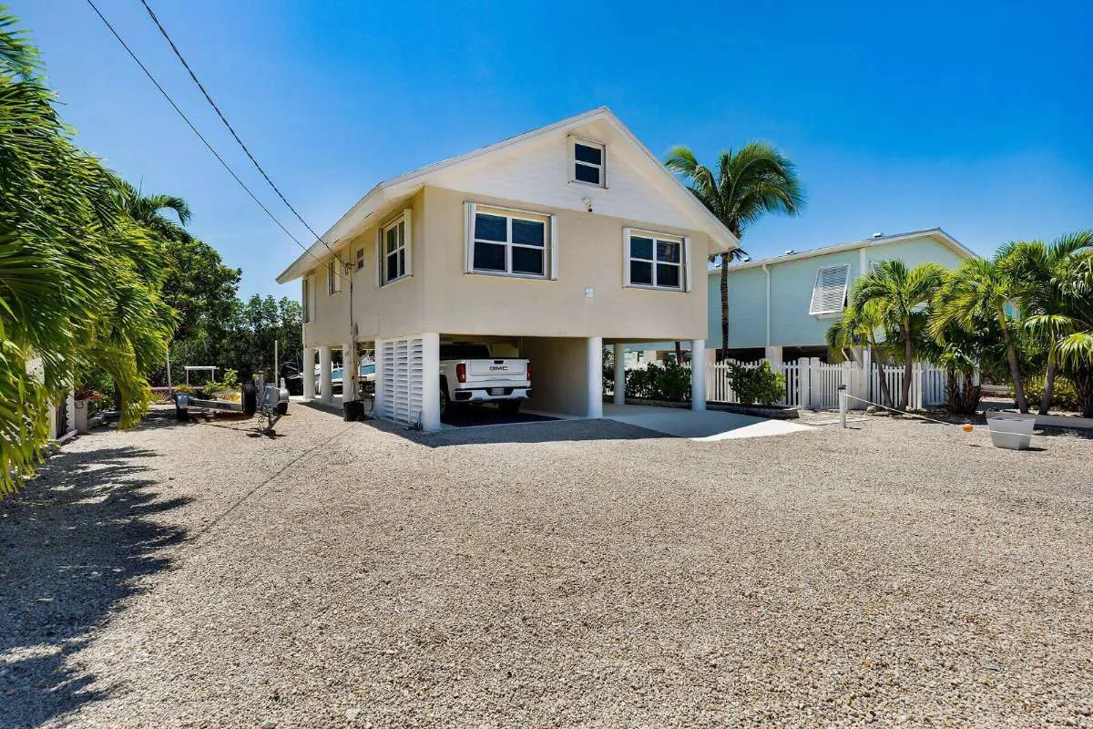 27322 Saint Martin Ln, a raised canalfront home in Breezeswept Beach Estates, Ramrod Key, Florida Keys