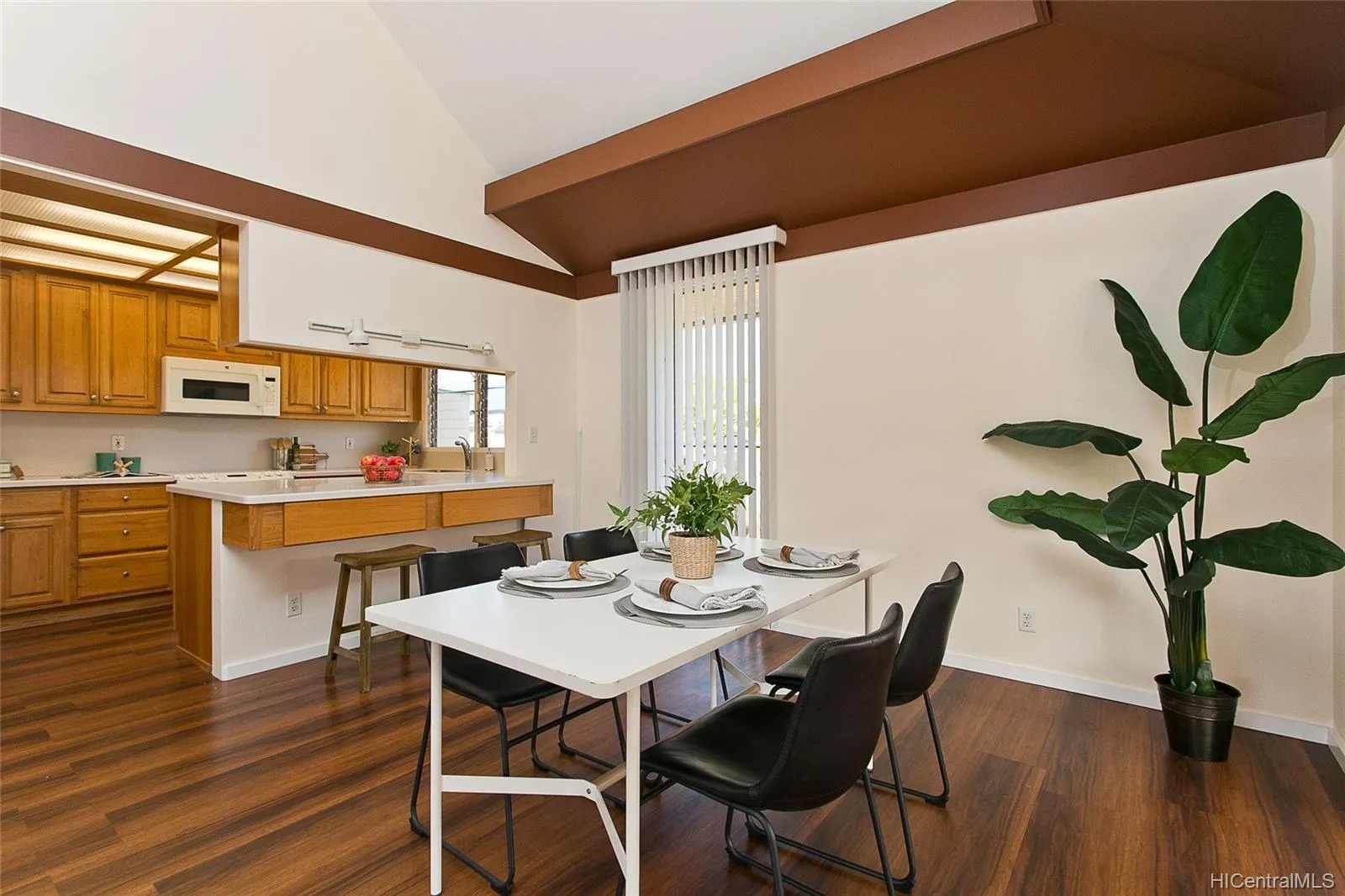 Open kitchen and dining area in a remodeled Mililani home