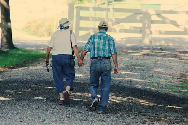 An old couple holding hands.