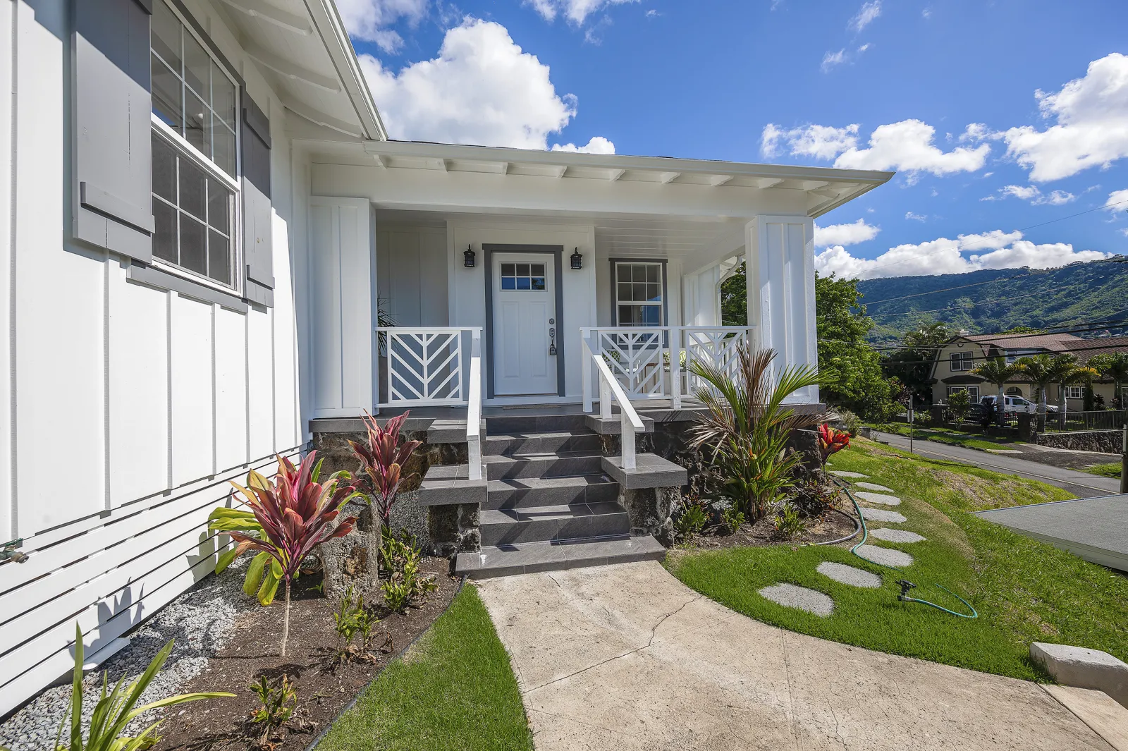 Bright renovated Manoa home interior with wood floors and large windows